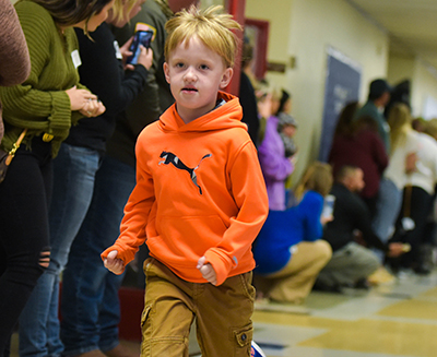 kid running down hall