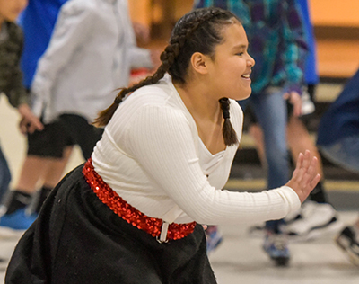 girl in poodle skirt doing the twist