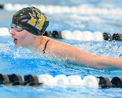 girl with head out of water during butterfly