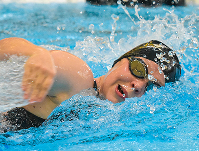 girl swimming with goggles