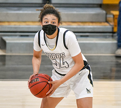 girl holding basketball