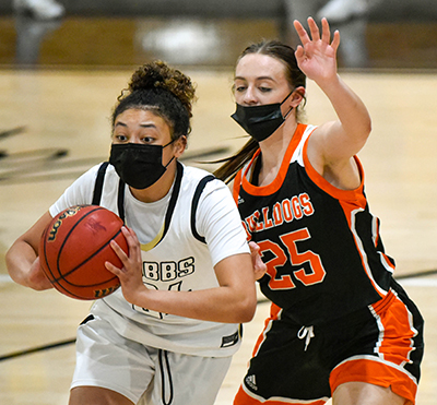 girl trying to make a pass while defended