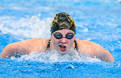 person swimming at camera