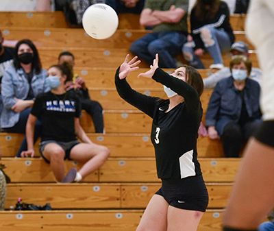 player setting the volleyball