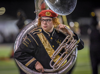 boy playing tuba