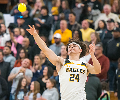 smiling player throwiing small ball into crowd