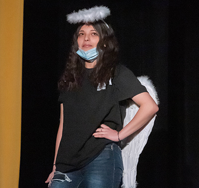 girl in halo standing on stage