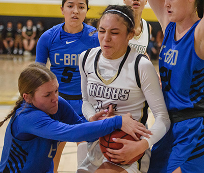 three players fighting for rebound