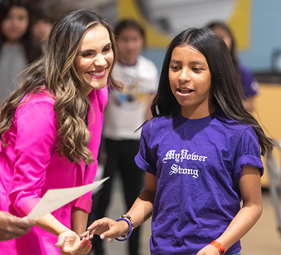 woman smiling at student