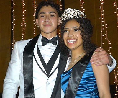 smiling boy and girl in formal wear