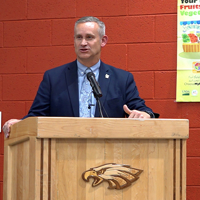 man standing at podium