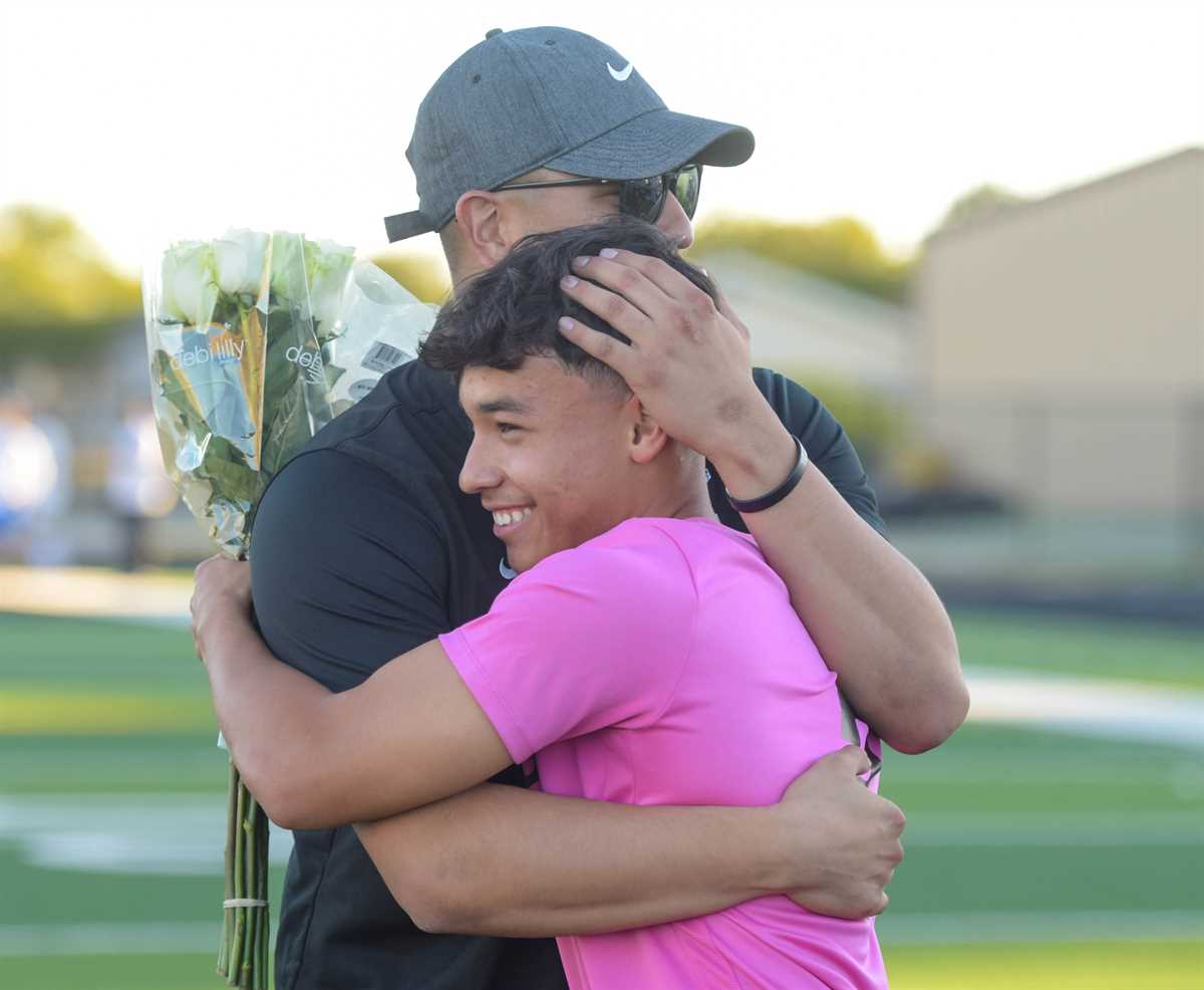 coach hugging player