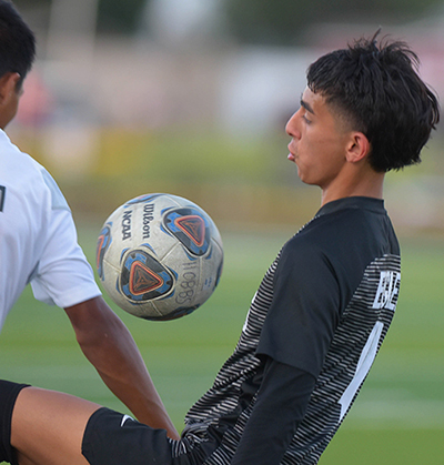 player stopping ball with knee