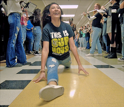 girl on floor doing splits