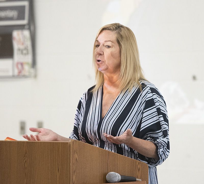 woman standing at podium