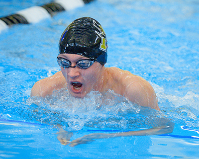 boy swimmer doing the breast stroke