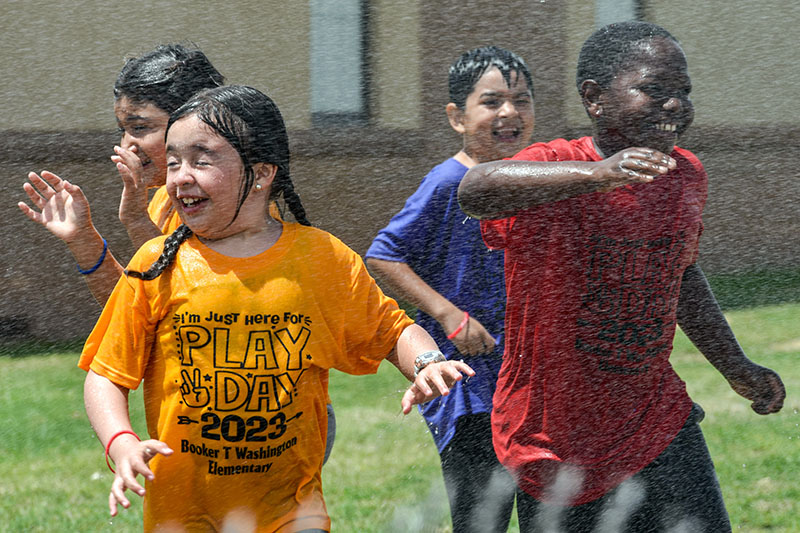 btw students playing in water