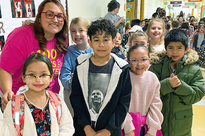 teacher posing with students