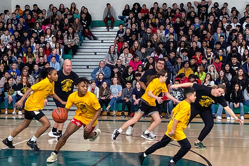 student driving up court