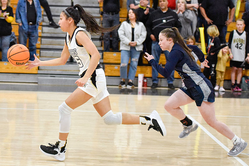 two girls driving up court