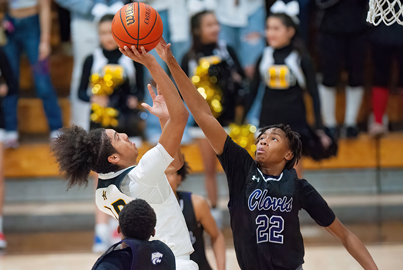 player shooting over a block