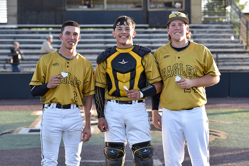 three seniors at home plate