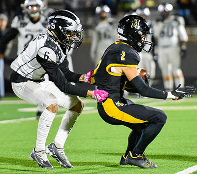 player running away from tackler