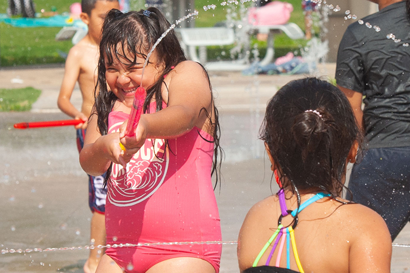 girl shooting squirt gun