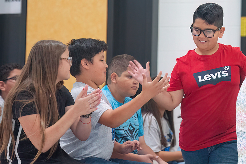 boy high fiving classmates