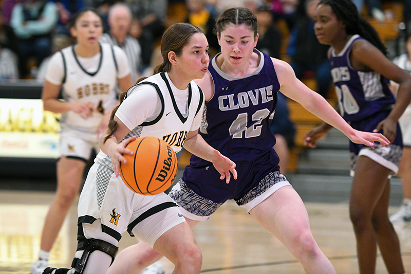 defense player advancing on ball