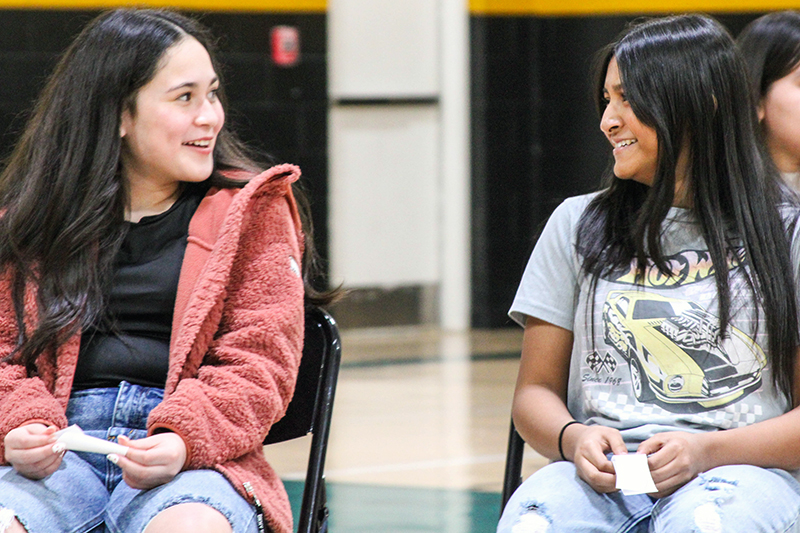 two girls looking at each other