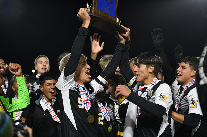 players lifting trophy