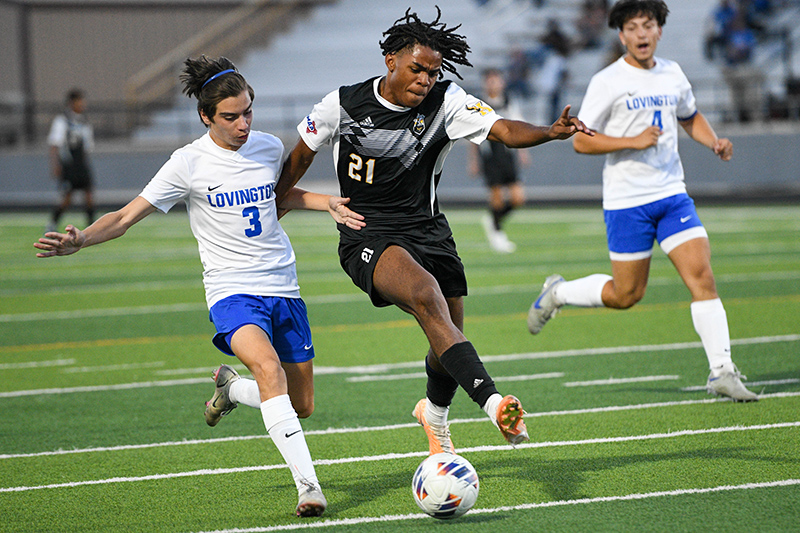 two players battle for the ball