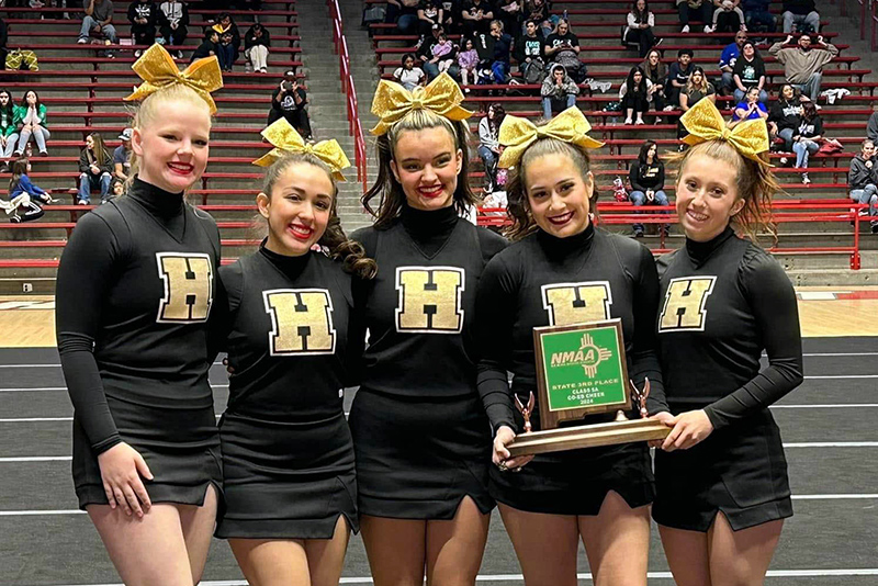 cheerleaders with trophy