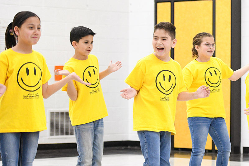 students dancing and laughing