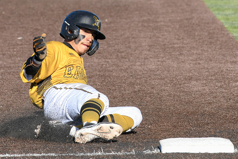 player sliding into third base