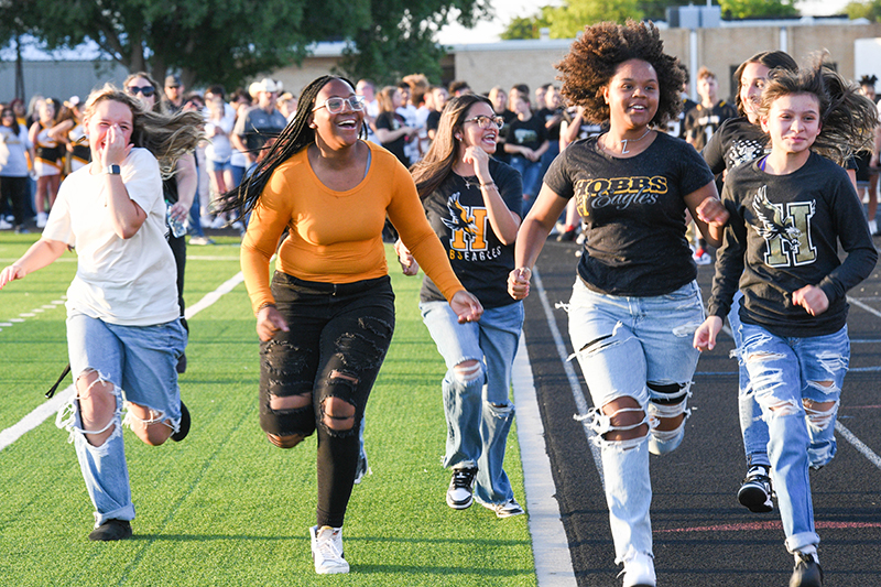 girls laughing and running