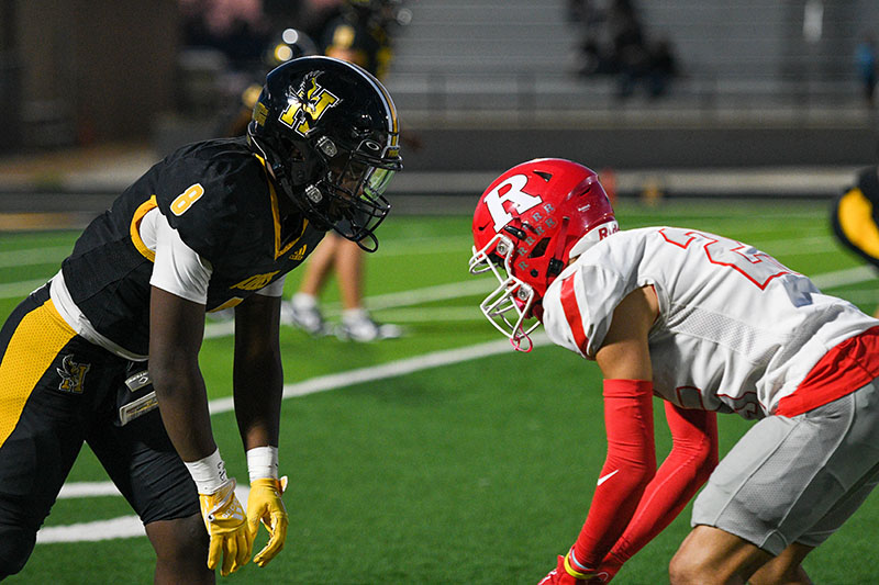 two football players going head to head