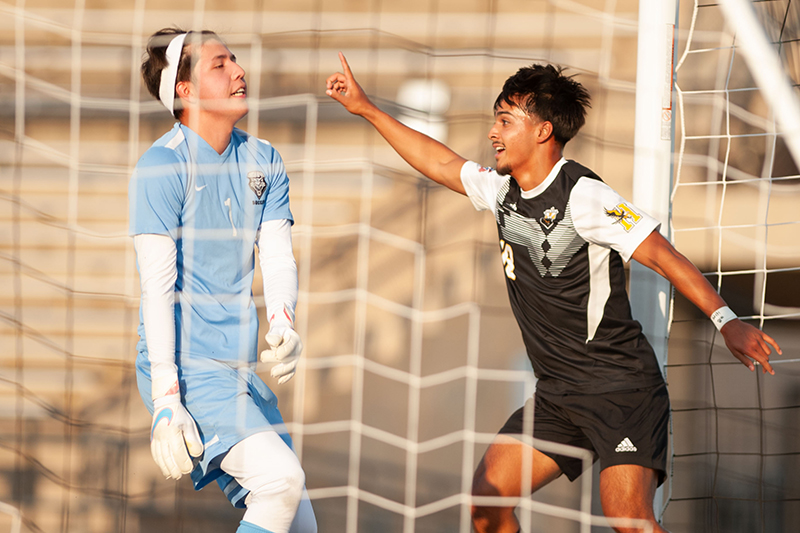 soccer players at goal