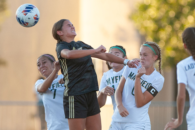 girl heading ball