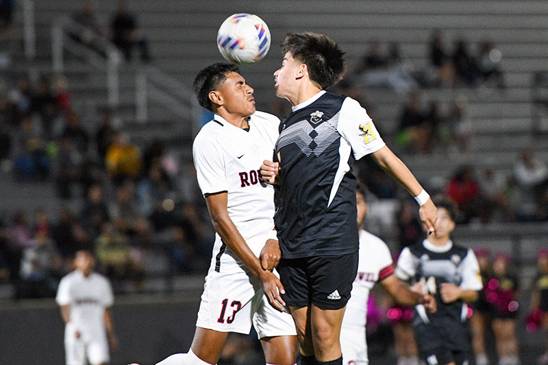 two players jump for header