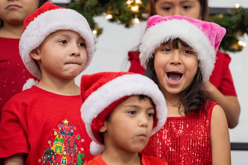 three kids singing 