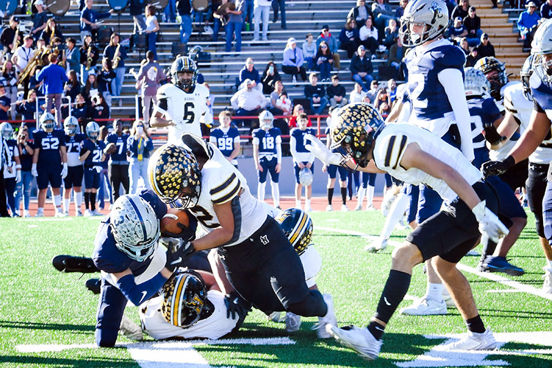 football player being tackled