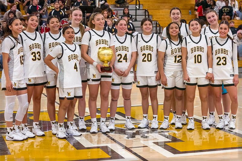 team of girls holding a trophy