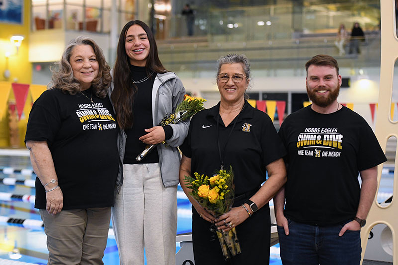 coaches with senior swimmer