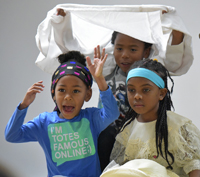 three students in a play