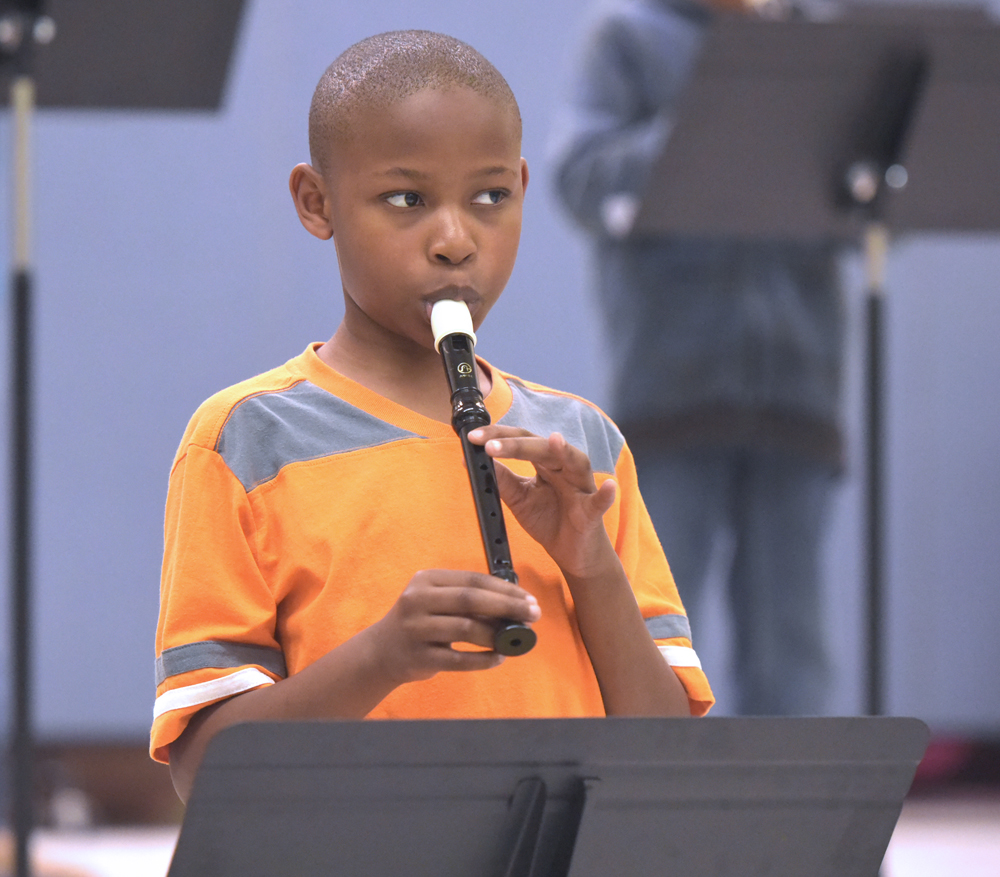 student playing recorder