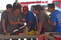 students looking at rocket